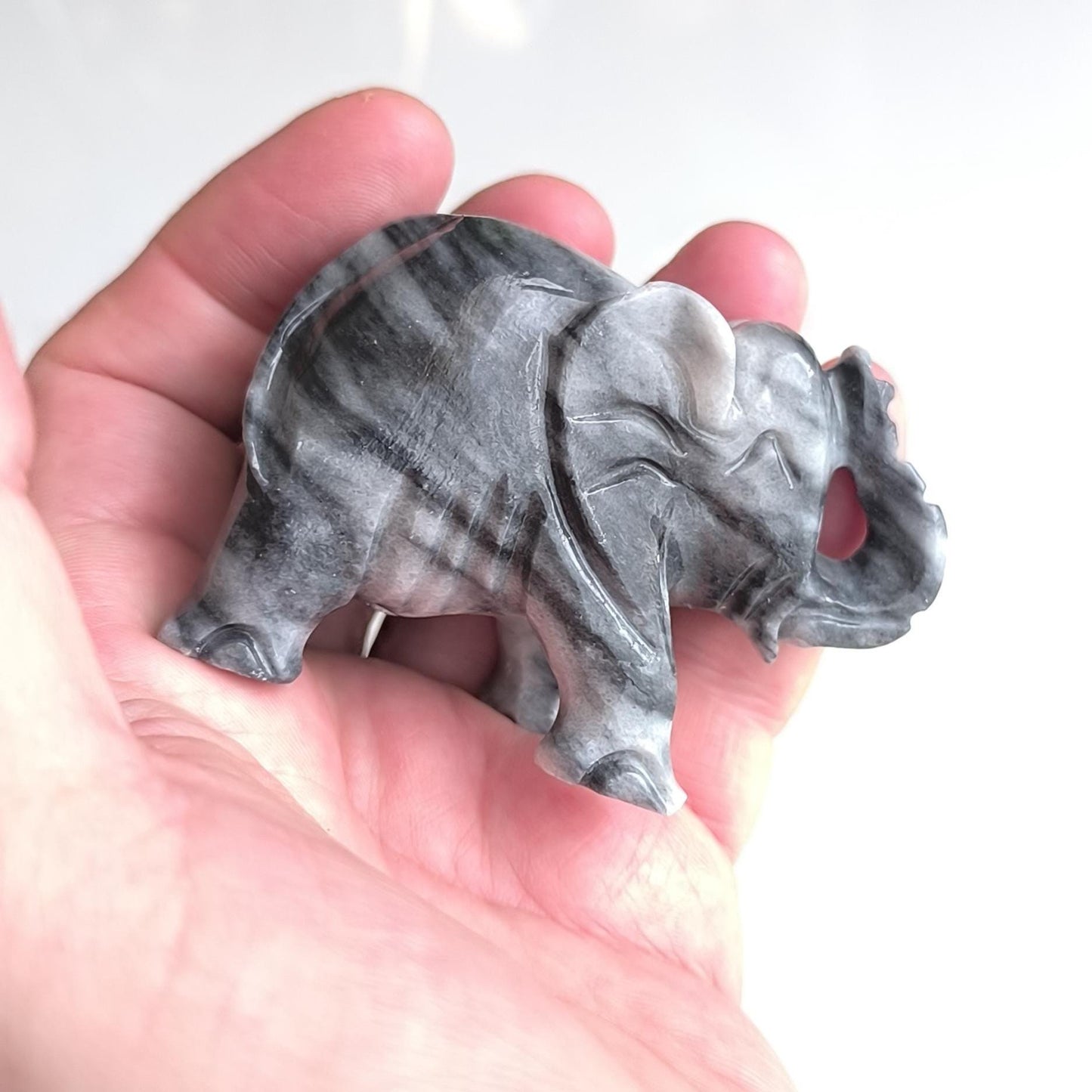 Handmade, small gray Asian elephant statue with raised trunk, 1980s