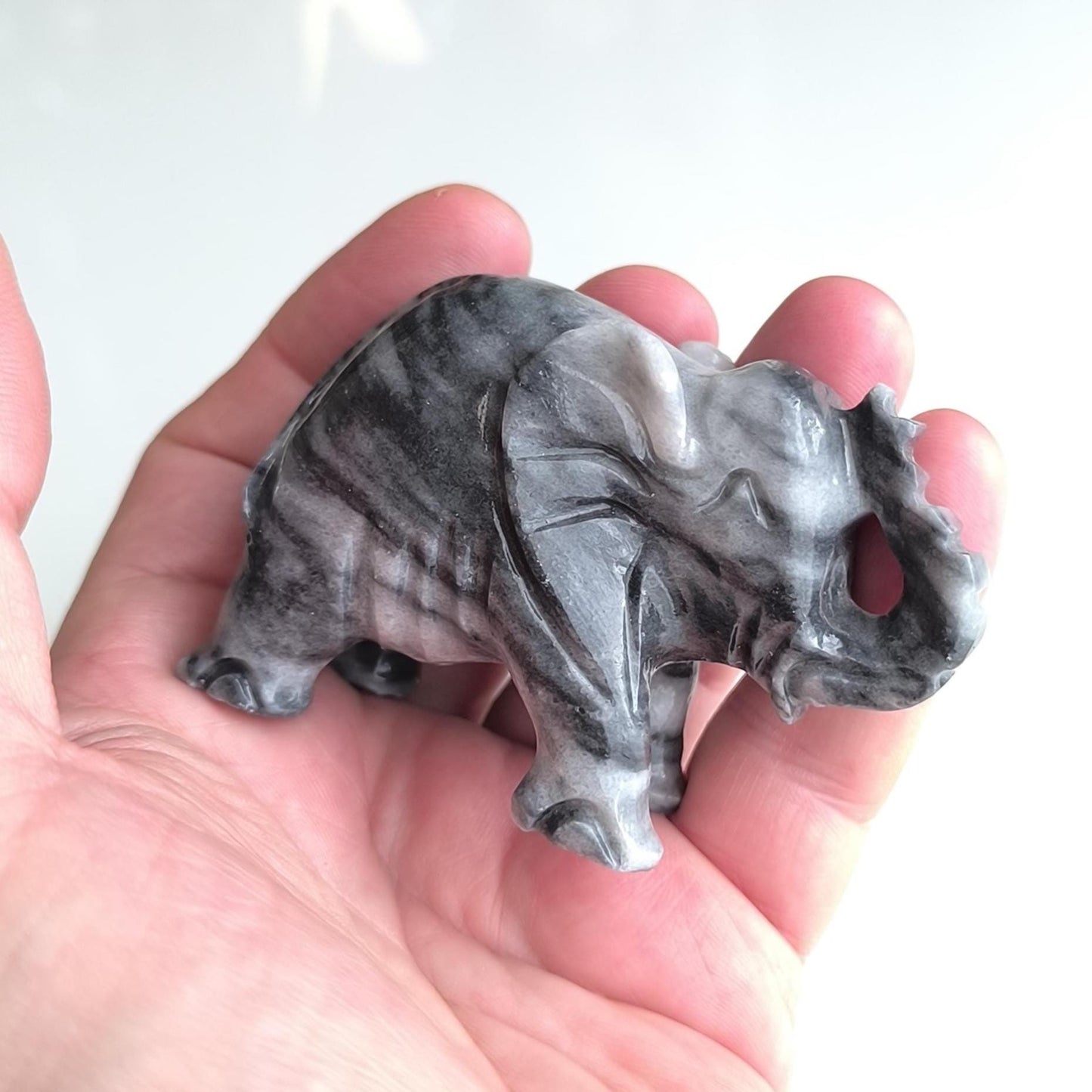 Handmade, small gray Asian elephant statue with raised trunk, 1980s