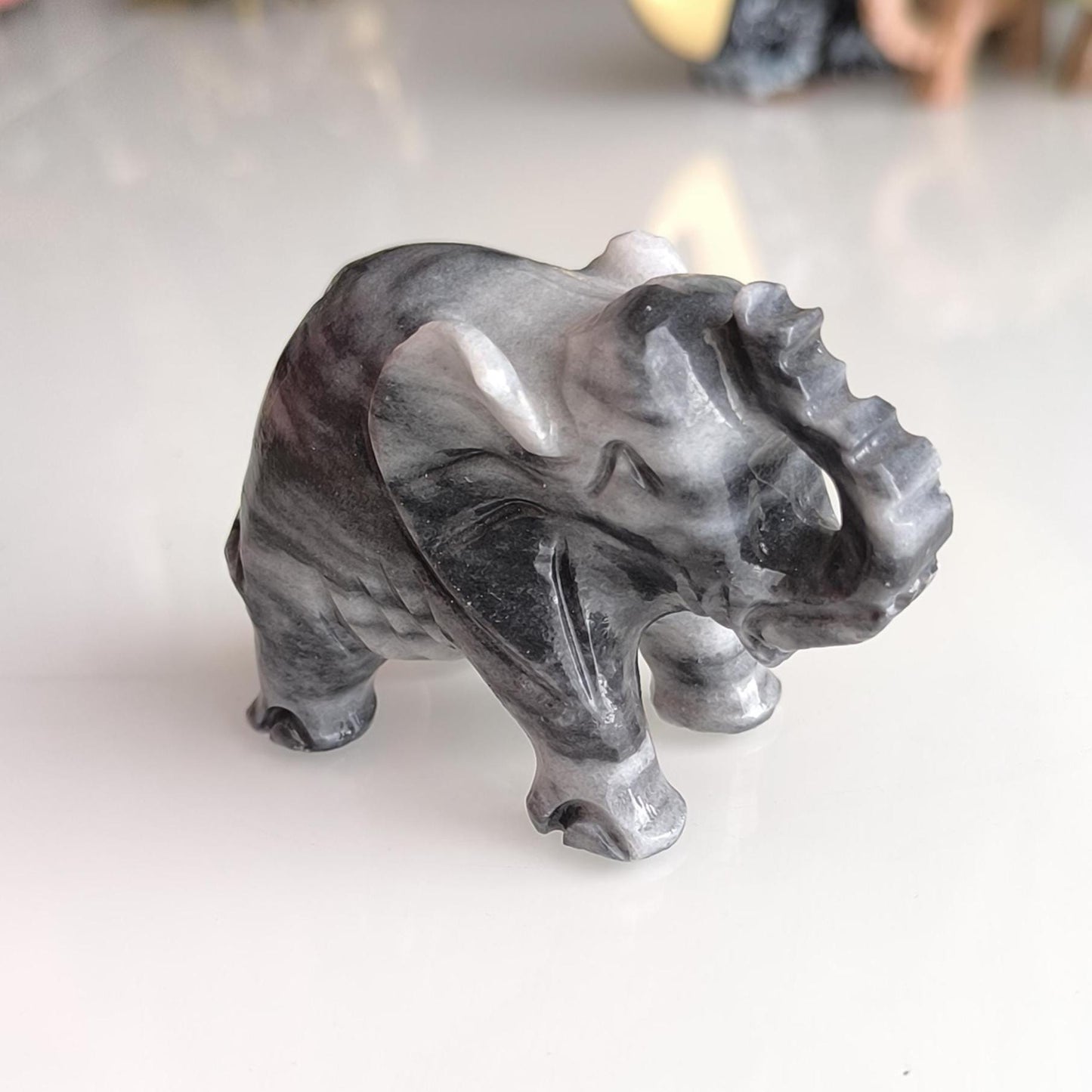 Handmade, small gray Asian elephant statue with raised trunk, 1980s