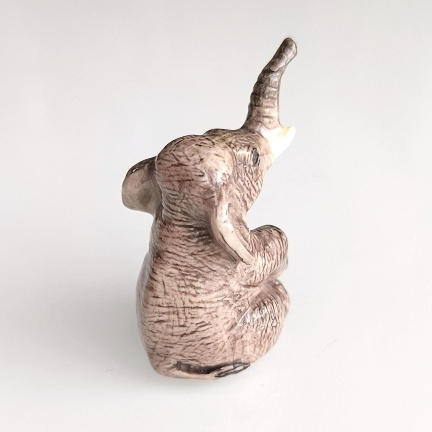 Gray Glazed Ceramic Sitting Elephant Trunk Up 1970s