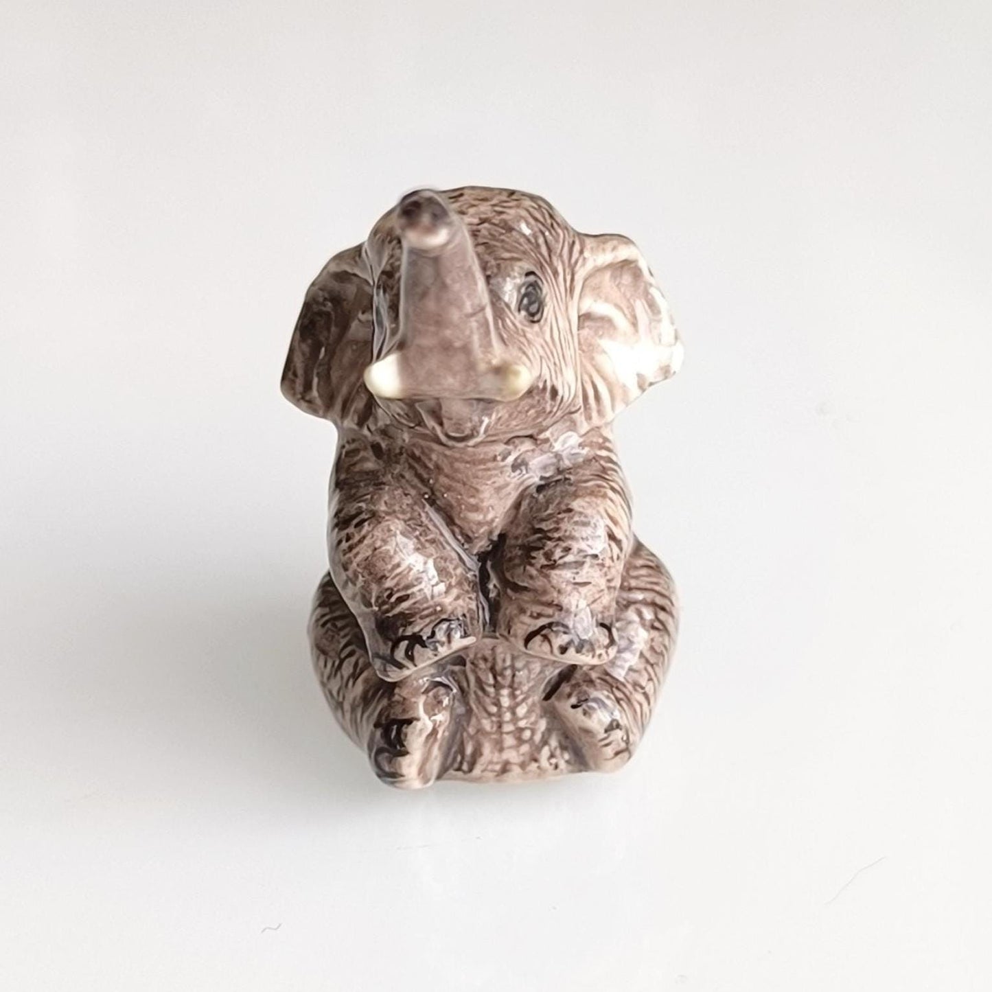 Gray Glazed Ceramic Sitting Elephant Trunk Up 1970s